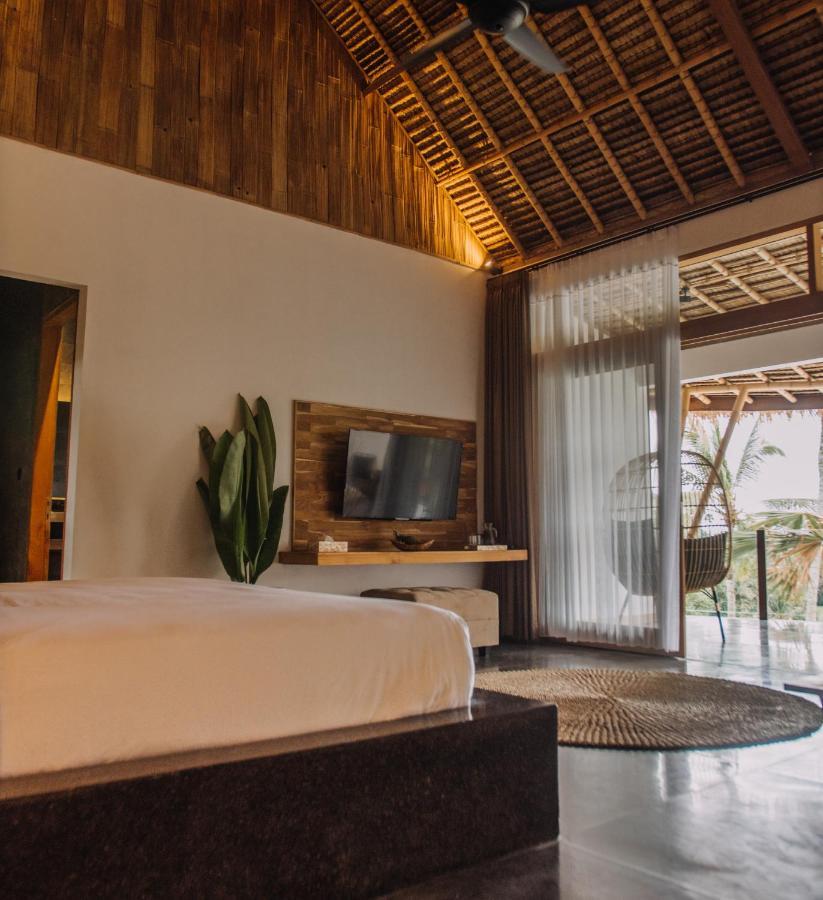 Hotel Neano Escape Manggis Exterior foto A bedroom at the resort